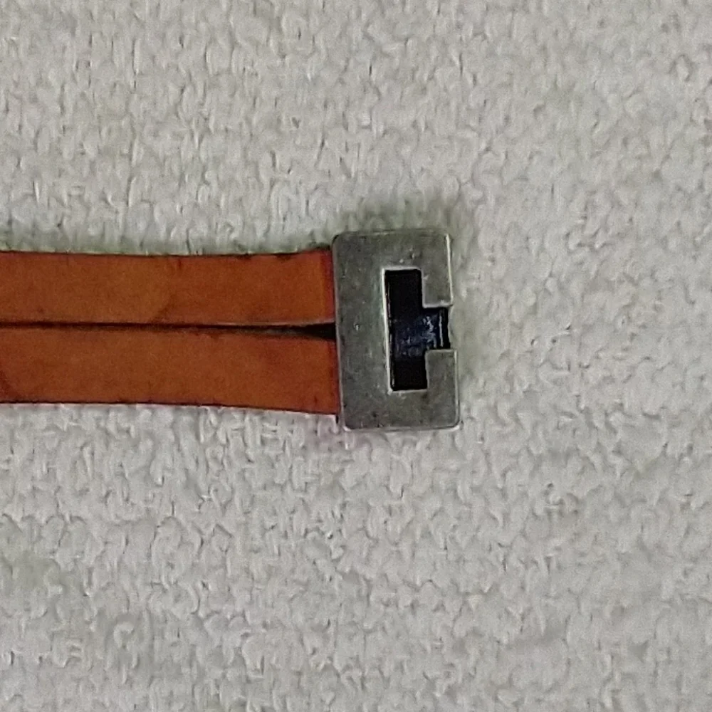 Silvertone faux amber brown leather bracelet